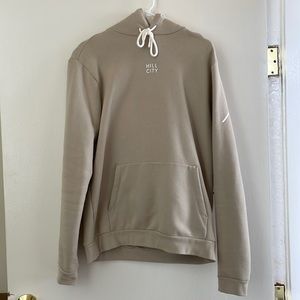 Hill City cream pullover hoodie with left side zip up pocket